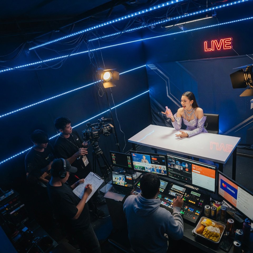 Limitless Studio production team in control room reviewing live commerce GMV analytics with ON AIR sign